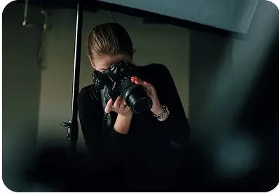 Photographer in the Dark Studio